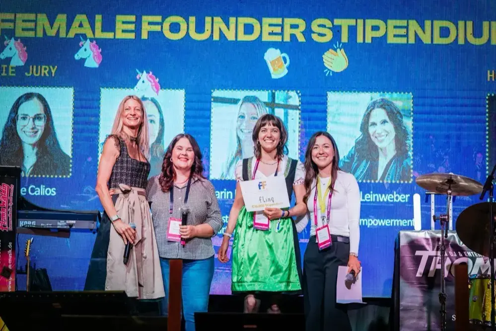 Valentina Mayer-Steudte receives the Female Founders Stipendium on the Gründerwasen 2026 stage, surrounded by the jury